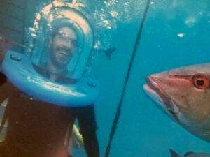 Me walking underwater looking like a Mars Attack alien